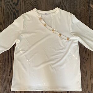 Ladies knit stretch top with asymmetrical neckline. .